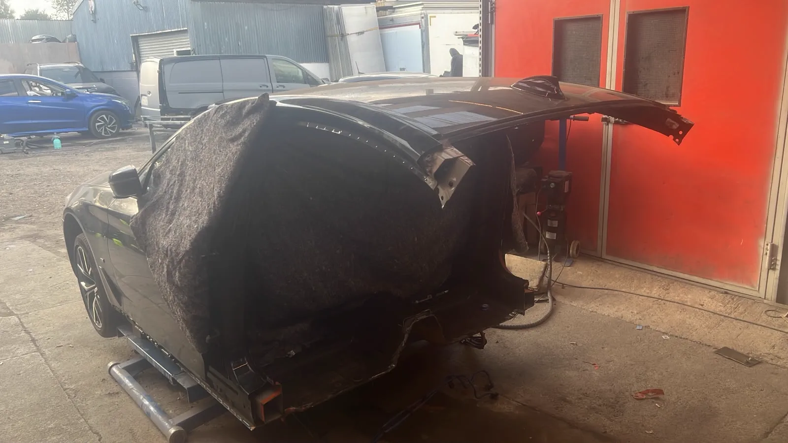 Car body shell on a repair jig during structural repair work