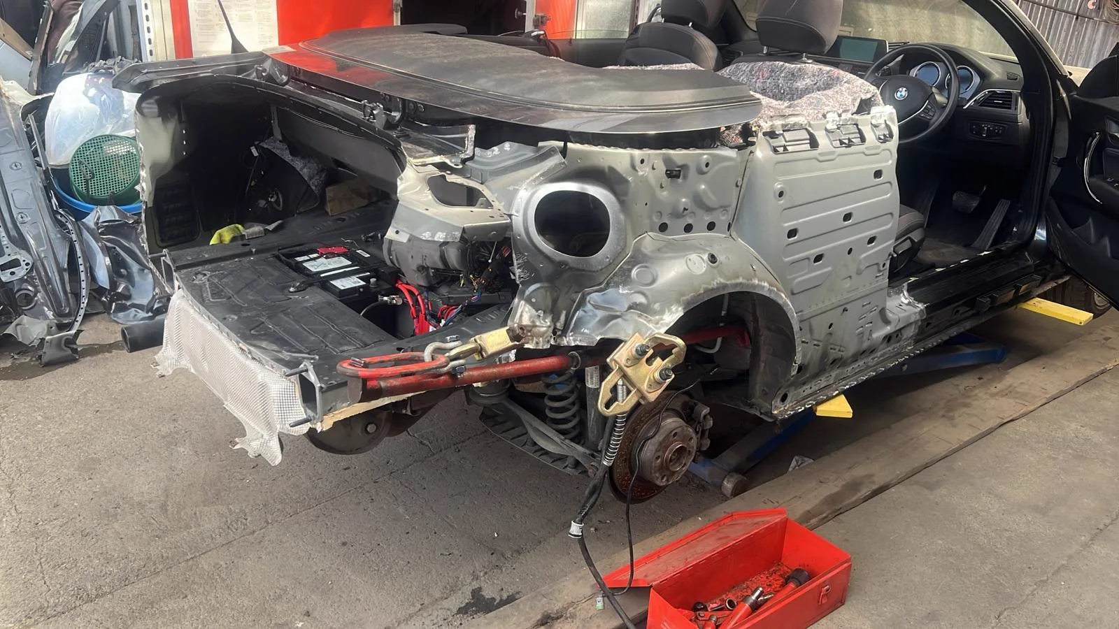 Stripped car body shell prepared for accident repair work